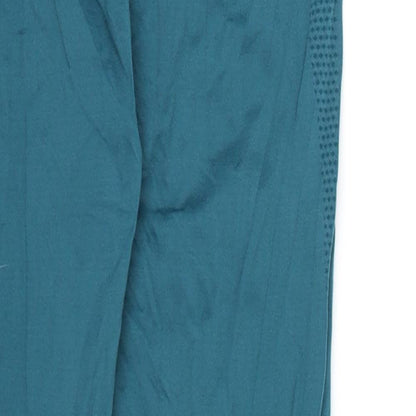 Close-up detail of Preworn women’s blue compression leggings, 27-inch leg