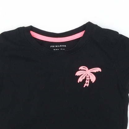 Close-up detail of Primark girls’ black basic t-shirt, size 18-24, months - palm tree