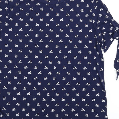 Brand and care label for Warehouse women’s blue animal print basic blouse, size UK 14