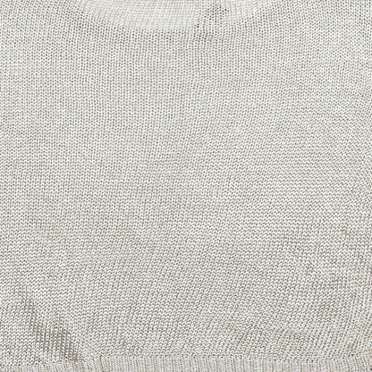 Brand and care label for Limited Edition women’s gold jumper, size UK 18
