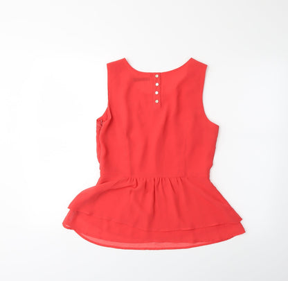 Back view of Dunnes women’s orange basic blouse, size UK 10