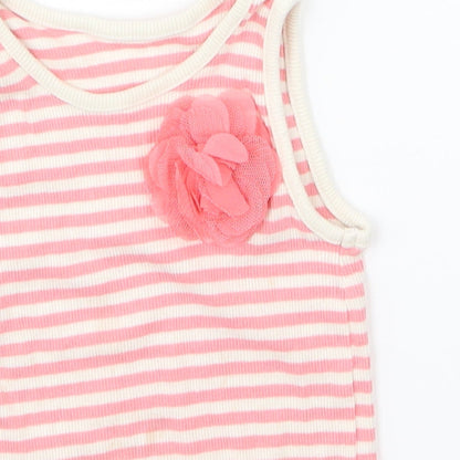 Close-up detail of Matalan girls’ pink basic tank, size 18-24, months - flower on front
