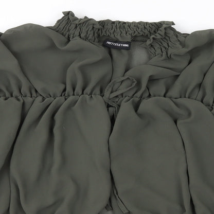 Close-up detail of PRETTYLITTLETHING women’s green basic blouse, size UK 12