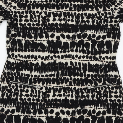 Brand and care label for F&F women’s black animal print basic blouse, size UK 8