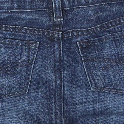 Brand and care label for Gap girls’ blue denim mini skirt, size 3, years