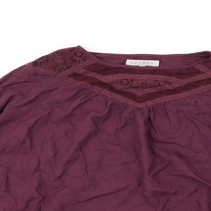 Close-up detail of Nutmeg women’s purple basic blouse, size UK 10