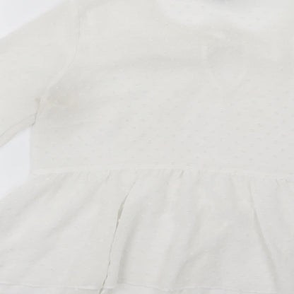 Brand and care label for Primark women’s white polka dot chiffon basic blouse, size UK 8