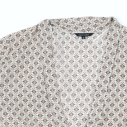 Close-up detail of New Look women’s ivory geometric basic blouse, size UK 16