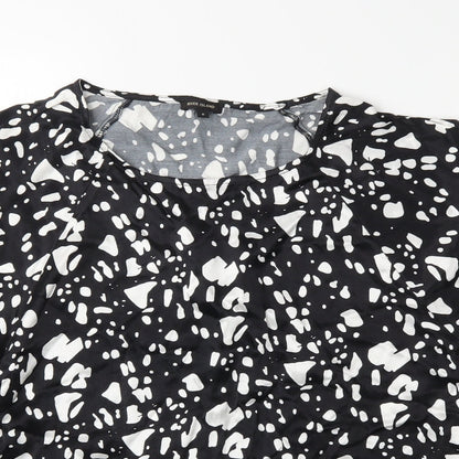 Close-up detail of River Island women’s black polka dot basic blouse, size UK 8