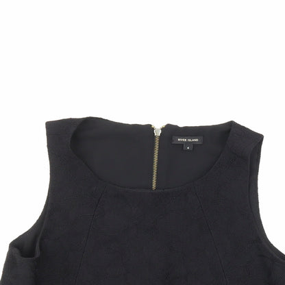 Close-up detail of River Island women’s black floral basic blouse, size UK 6
