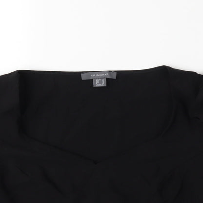 Close-up detail of Atmosphere women’s black basic blouse, size UK 14