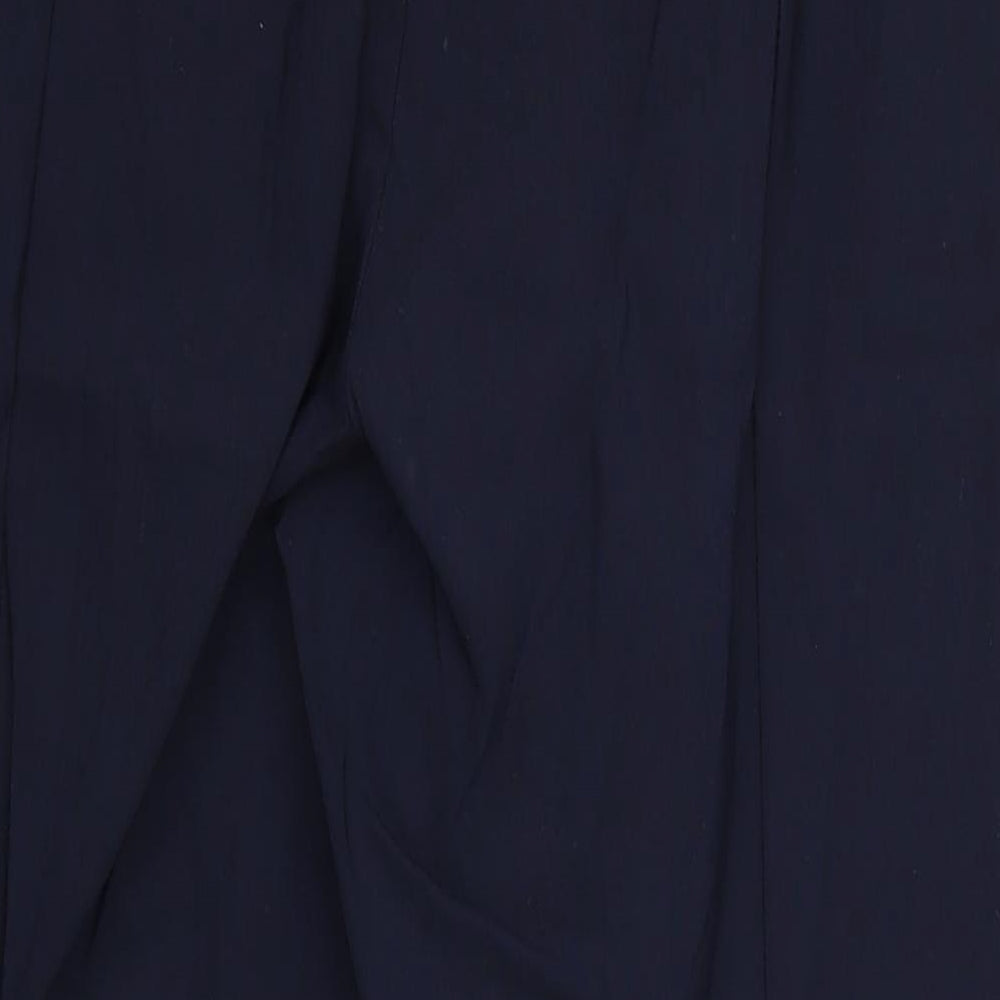Brand and care label for Preworn women’s blue cropped trousers, size UK 32, in, 22-inch leg