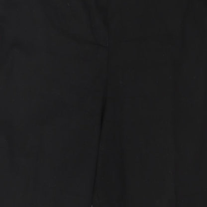 Close-up detail of Preworn women’s black trousers, size UK 36, in, 27-inch leg