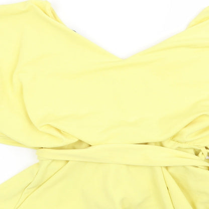 Brand and care label for Quiz women’s yellow basic blouse, size UK 12