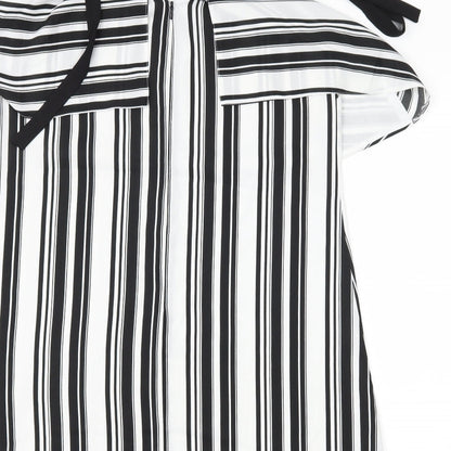 Brand and care label for Miss Selfridge women’s black striped shift, size UK 12