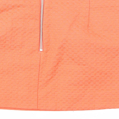 Brand and care label for Topshop women’s orange a-line skirt, size UK 10