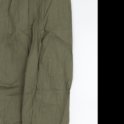 Close-up detail of H&M women’s green trousers, size UK 6