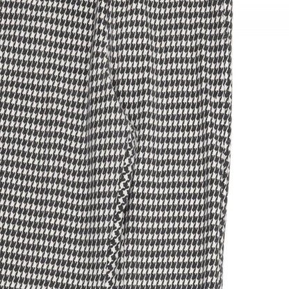 Close-up detail of Topshop women’s black houndstooth carrot trousers, size UK 10, 28-inch leg