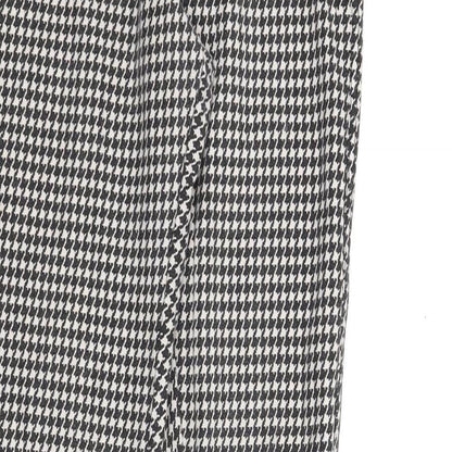 Brand and care label for Topshop women’s black houndstooth carrot trousers, size UK 10, 28-inch leg