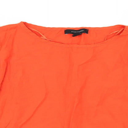 Close-up detail of Primark women’s orange tunic blouse, size UK 8