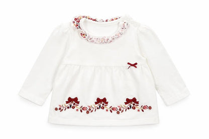 Front view of Nutmeg girls’ white floral basic t-shirt, size 3-6, months