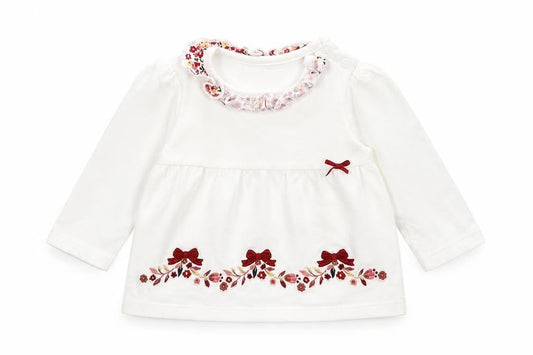Front view of Nutmeg girls’ white floral basic t-shirt, size 3-6, months