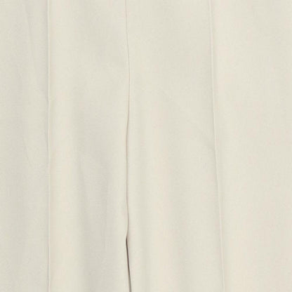Close-up detail of Preworn women’s beige trousers, size UK 18, 27-inch leg