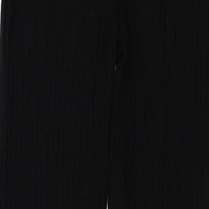 Brand and care label for PRETTYLITTLETHING women’s black trousers, size M, 26-inch leg