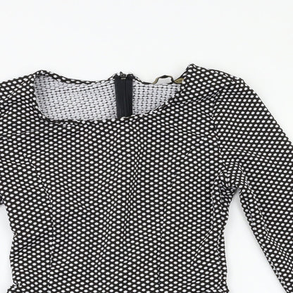 Close-up detail of classic tricot women’s black polka dot basic t-shirt, size M