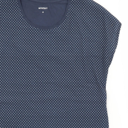 Close-up detail of Montego women’s blue polka dot basic blouse, size M