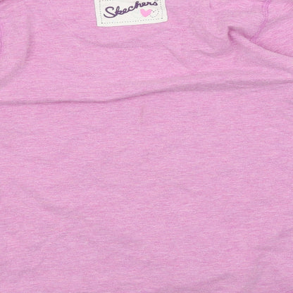 Brand and care label for Skechers girls’ purple floral basic blouse, size 6-7, years