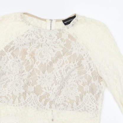 Close-up detail of PRETTYLITTLETHING women’s ivory cropped blouse, size UK 8