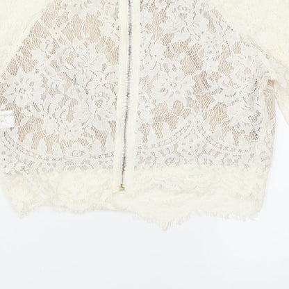 Brand and care label for PRETTYLITTLETHING women’s ivory cropped blouse, size UK 8