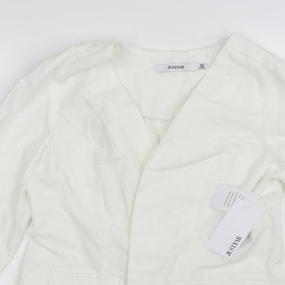 Close-up detail of JustFab women’s white jacket, size XS