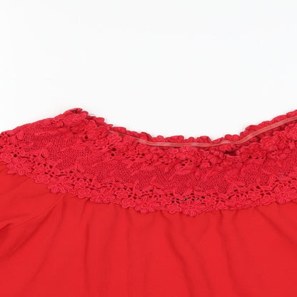 Close-up detail of Quiz women’s red basic blouse, size UK 8