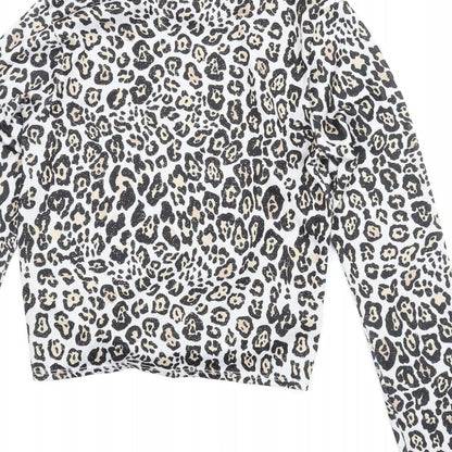 Brand and care label for Candy Couture girls’ beige animal print basic blouse, size 13, years