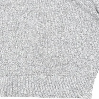 Brand and care label for PRETTYLITTLETHING women’s grey jumper, size M
