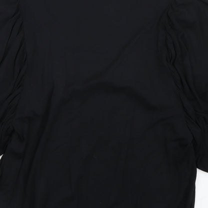 Brand and care label for Warehouse women’s black basic t-shirt, size UK 12