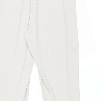 Brand and care label for PRETTYLITTLETHING women’s beige trousers, size UK 12, 30-inch leg