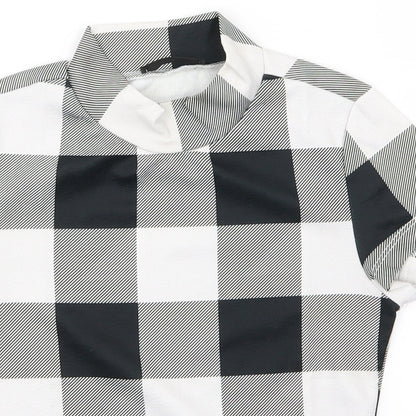 Close-up detail of SHEIN boys’ black plaid basic t-shirt, size XS