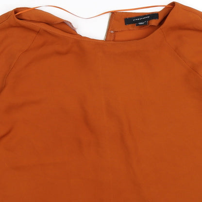 Close-up detail of Atmosphere women’s brown basic blouse, size UK 8, - burnt orange