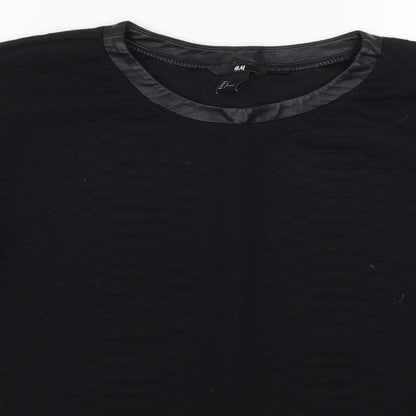 Close-up detail of H&M women’s black pullover sweatshirt, size L