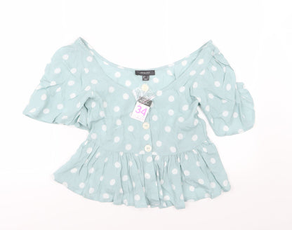 Front view of Primark women’s green polka dot basic blouse, size UK 6