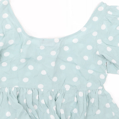 Brand and care label for Primark women’s green polka dot basic blouse, size UK 6