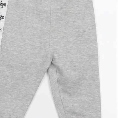 Brand and care label for Hype boys’ grey sweat shorts, size 7, years