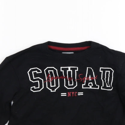 Close-up detail of studio girls’ black jumper, size 6-7, years