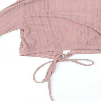 Brand and care label for Missguided women’s pink cardigan jumper, size UK 6
