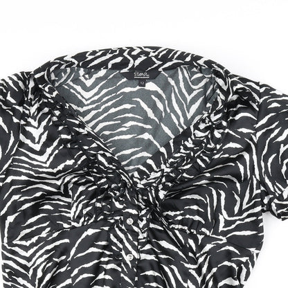 Close-up detail of Star women’s black basic blouse, size UK 12