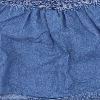 Brand and care label for Tu girls’ blue a-line skirt, size 10, years