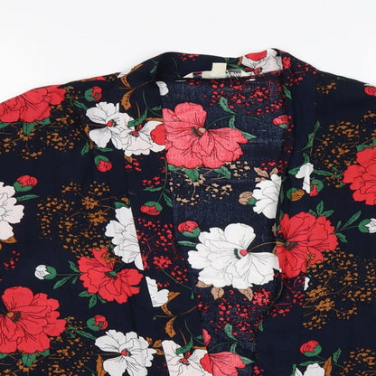 Close-up detail of Yumi women’s blue floral wrap jumper, size S